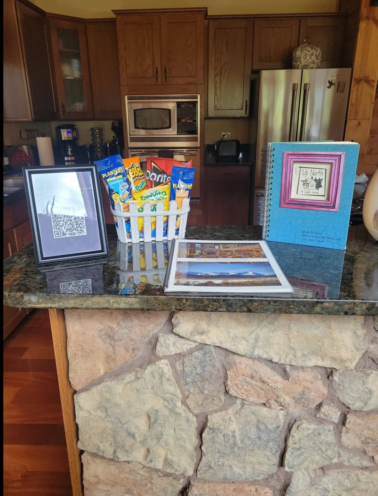 Welcome basket, house guide, and cabin journal set out for guests