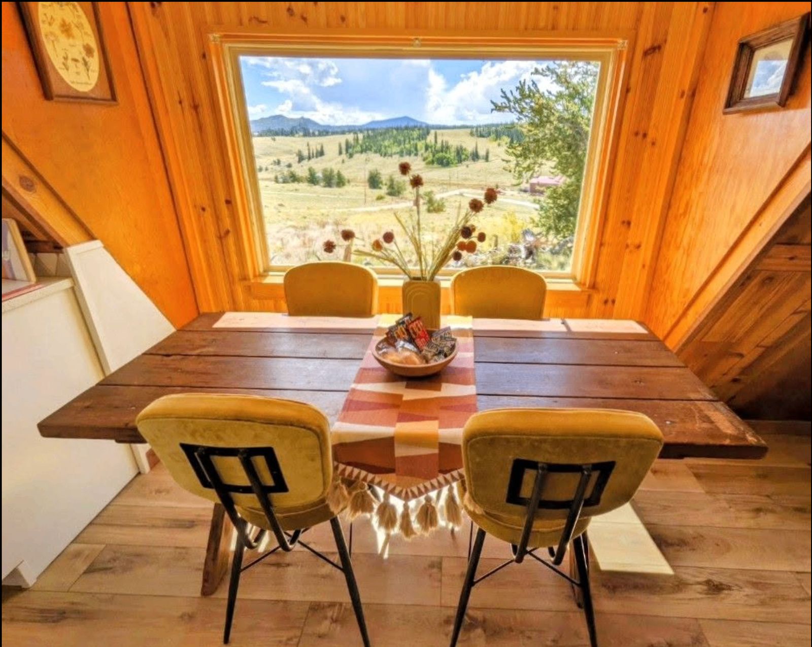 Cabin dining nook framing panoramic South Park mountain views