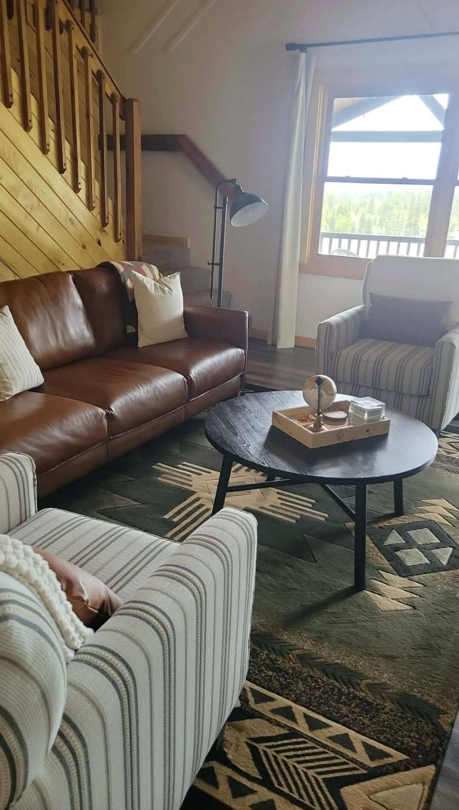 Cozy leather sofa and styled living room ready for guests
